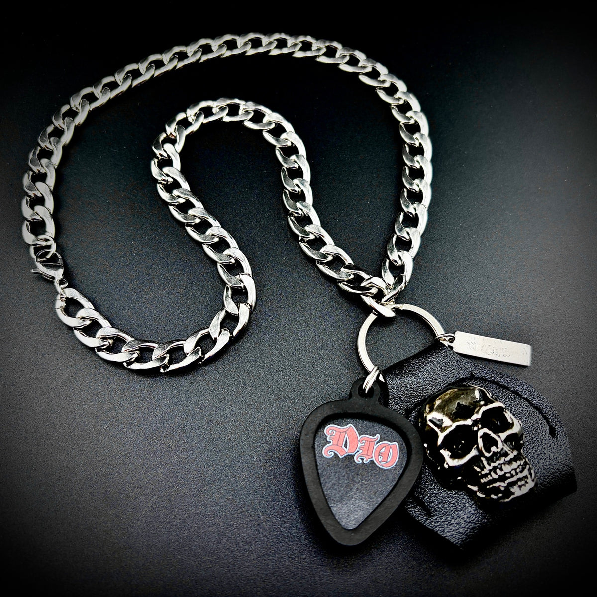 DIO RED LOGO guitar pick pendant necklace with silver curb chain and skull holder by SKULL & CHAIN. For fans of Ronnie James Dio.