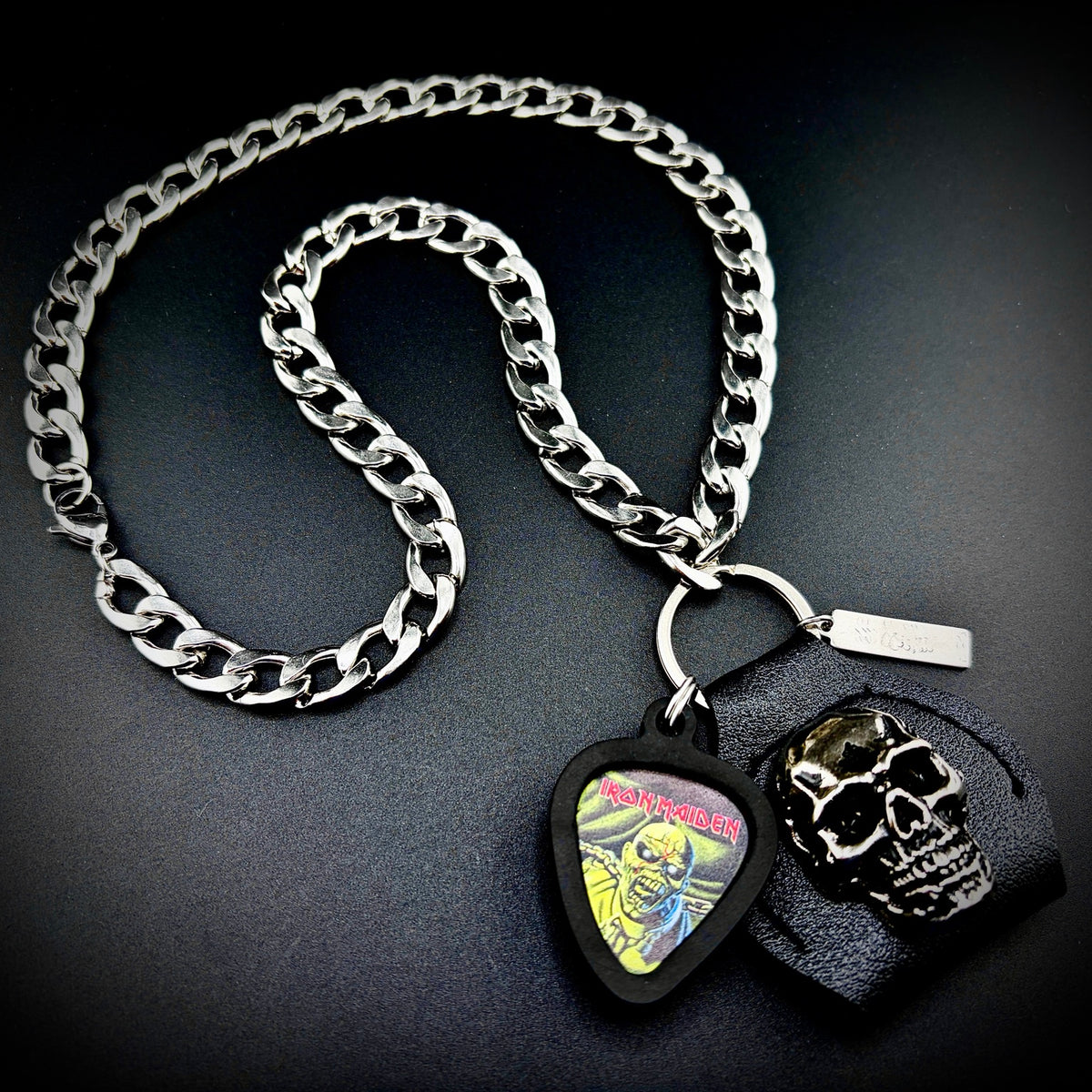 IRON MAIDEN PIECE OF MIND GUITAR PICK PENDANT NECKLACE by SKULL & CHAIN. For fans of Bruce Dickinson, Steve Harris, Dave Murray and Adrian Smith.
