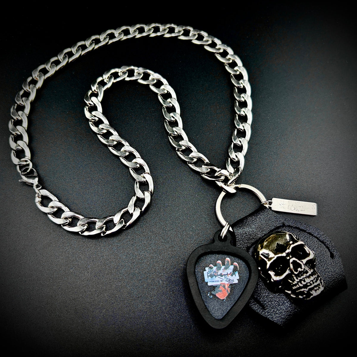 JUDAS PRIEST RAZORS EDGE GUITAR PICK PENDANT NECKLACE by SKULL & CHAIN. For fans of Rob Halford, Glenn Tipton and K. K. Downing.