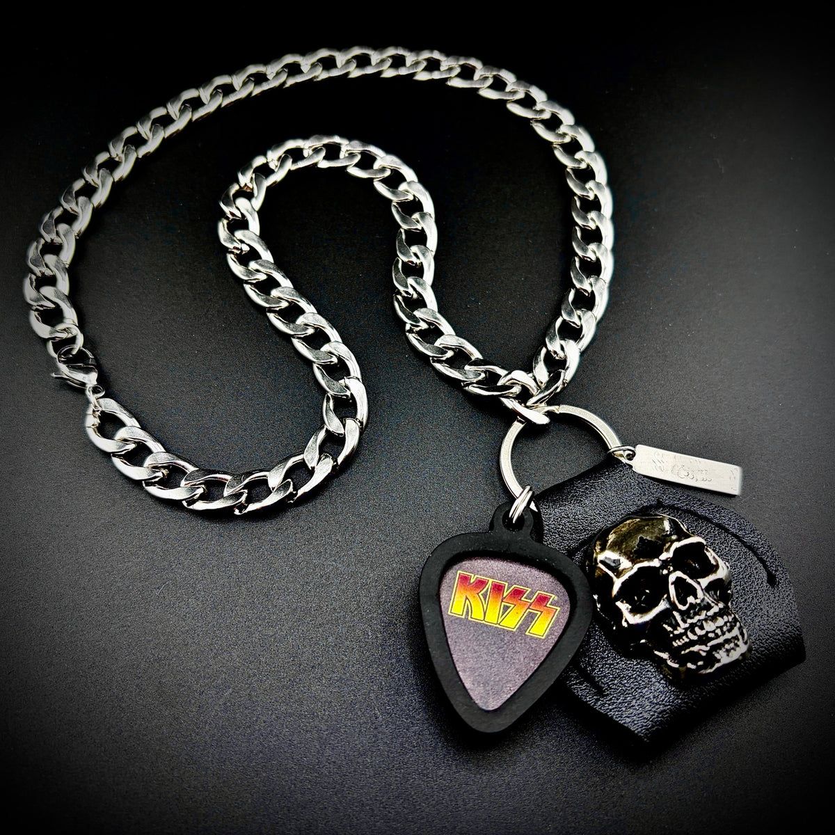 KISS Yellow Gradient Logo Guitar Pick Pendant Necklace by SKULL & CHAIN. For fans of Paul Stanley, Gene Simmons, Ace Frehley and Peter Criss.