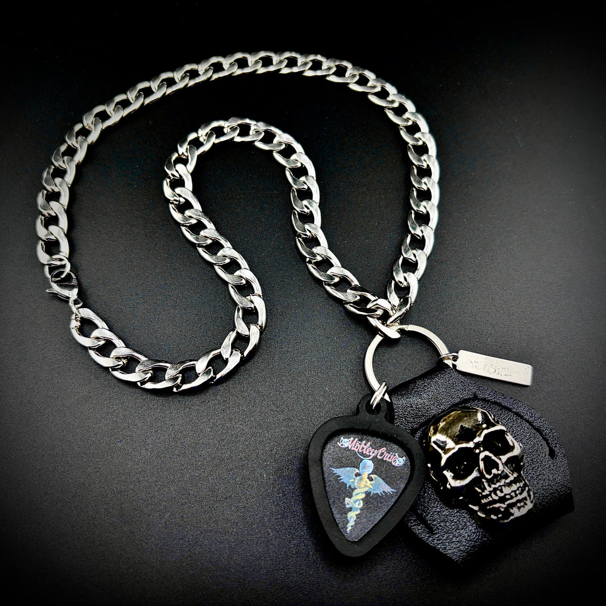 Mötley Crüe Dr. Feelgood Guitar Pick Pendant Necklace by SKULL & CHAIN. For fans of Mick Mars and Vince Neil.