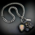OZZY OSBOURNE RED PORTRAIT guitar pick pendant necklace with silver curb chain and skull holder by SKULL & CHAIN. For fans of Ozzy Osbourne.