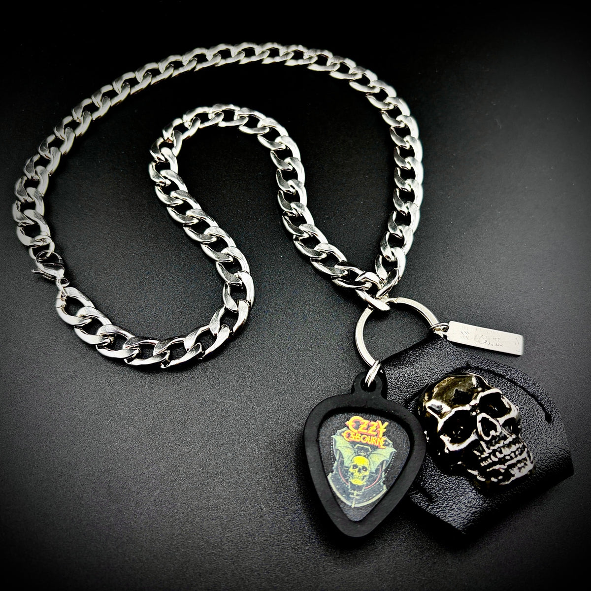 Ozzy Osbourne Skull Bat Guitar Pick Pendant Necklace by SKULL & CHAIN. For fans of Ozzy Osbourne.
