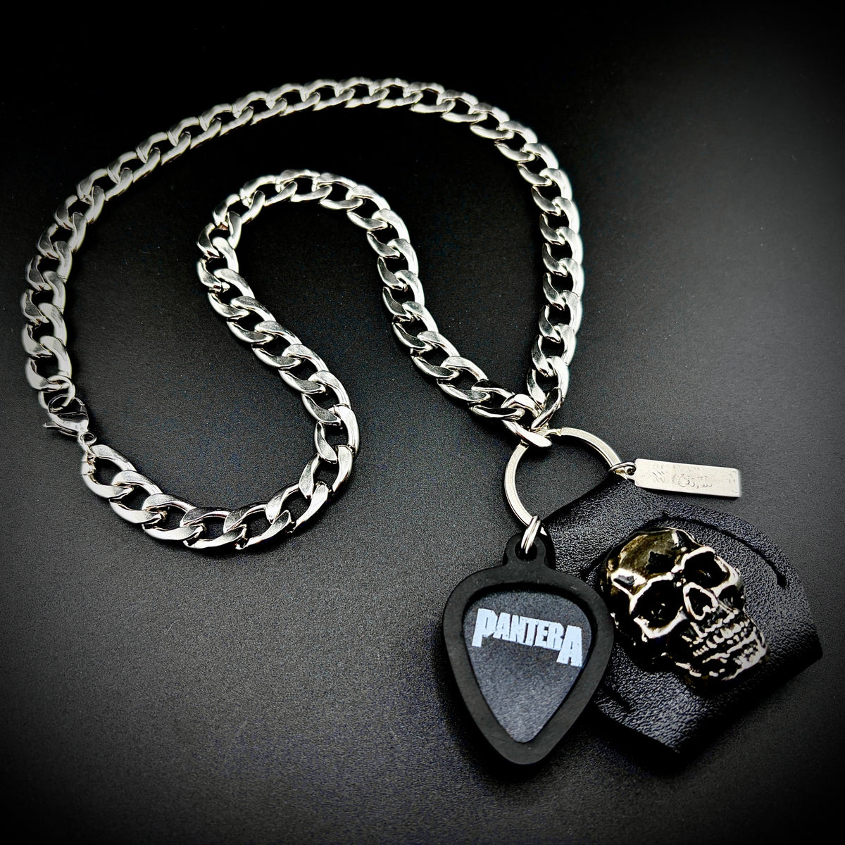PANTERA WHITE LOGO guitar pick pendant necklace with silver curb chain and skull holder by SKULL & CHAIN. For fans of Dimebag Darrell.