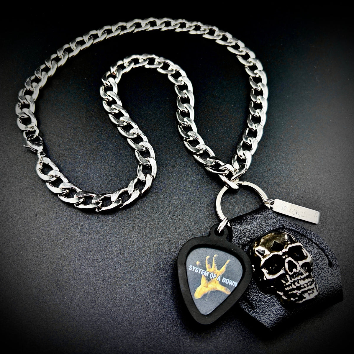 System Of A Down Guitar Pick Pendant Necklace by SKULL & CHAIN. For fans of Daron Malakian and Serj Tankian.